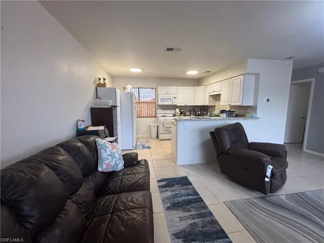 Living room featuring light tile patterned floors