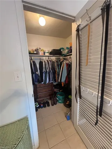 Spacious closet featuring tile patterned flooring