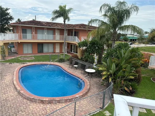 Community pool featuring a patio area