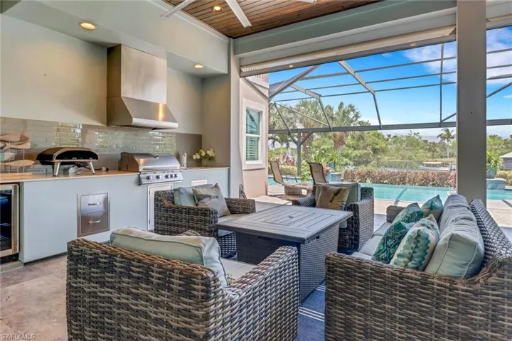 Outdoor living is enjoyable in your covered lanai with summer kitchen and living area immediately adjacent to the pool and pool bath.