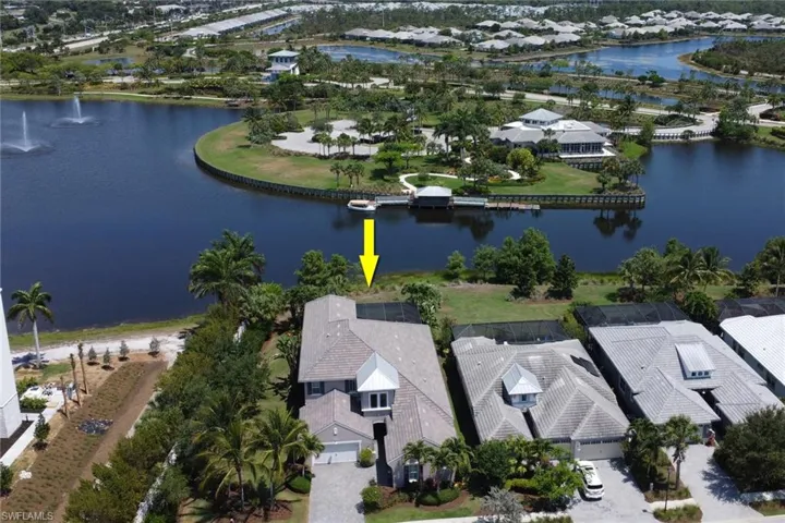 Another aerial view of the home at end of the cul-de-sac and views of the waterway behind the home.