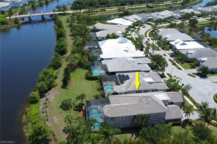 This aerial view of the home shows the home's location overlooking the waterway behind it.