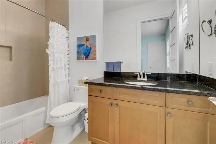 Bedroom #3's Bathroom with tile floor and tub/shower combination.