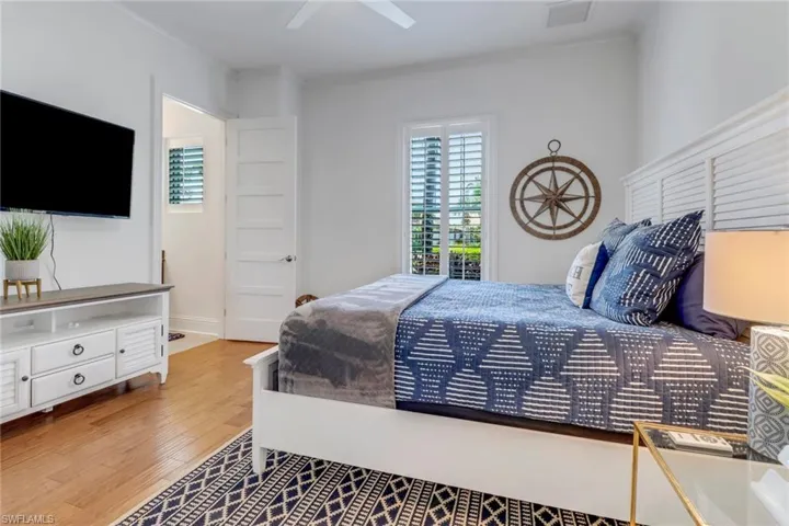 Bedroom #2 with hardwood flooring, full bath with tile floor and walk-in closet.