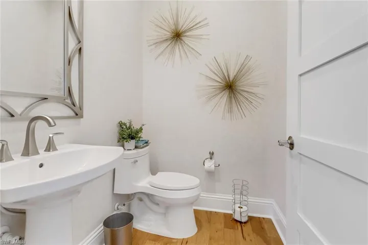 The first floor powder room is off the foyer and adjacent to the Den.