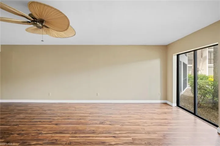 Empty room featuring wood finished floors and ceiling fan