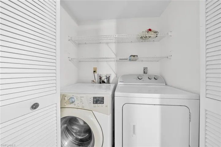 Laundry room featuring independent washer and dryer