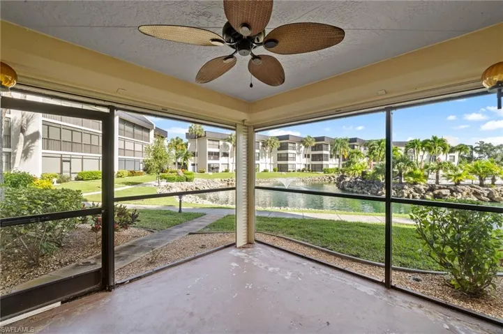 Unfurnished sunroom with a water view