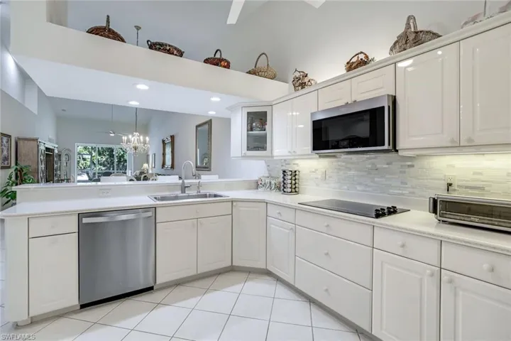 Spacious White Kitchen & Stainless Steel Appliances