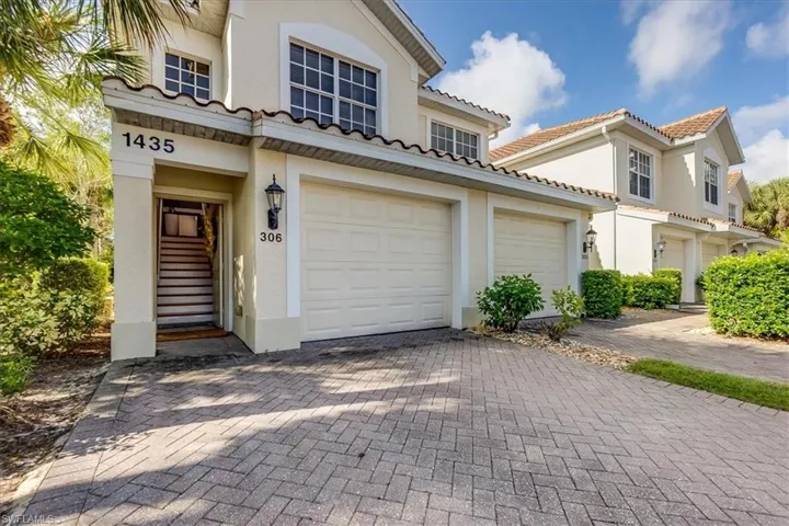 One car attached garage and driveway wide enough for 2 cars