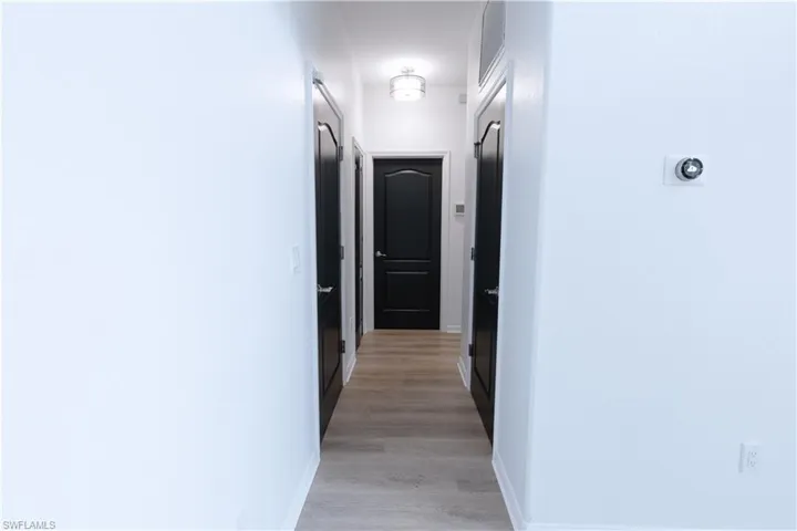 Hallway Leading to Downstairs Bedroom and Full Bathroom