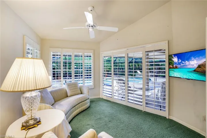 sitting area/office off of the pool