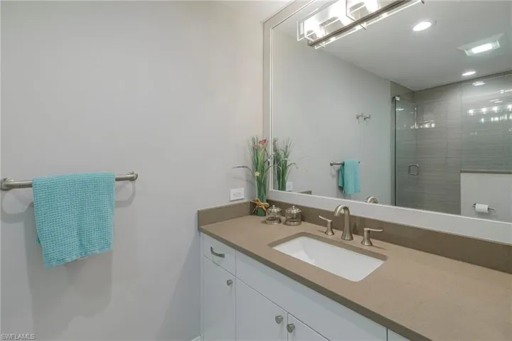 Bathroom with walk in shower and vanity