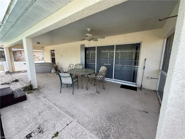 Covered back porch overlooking the pool