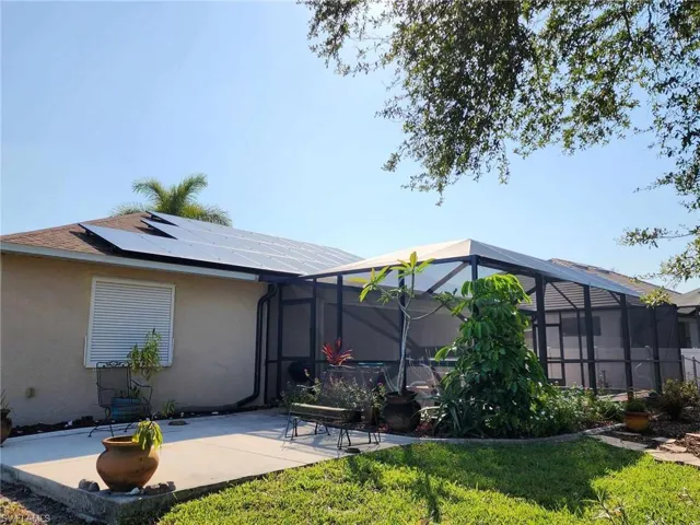 most of solar panels on back side of roof; patio outside of lanai