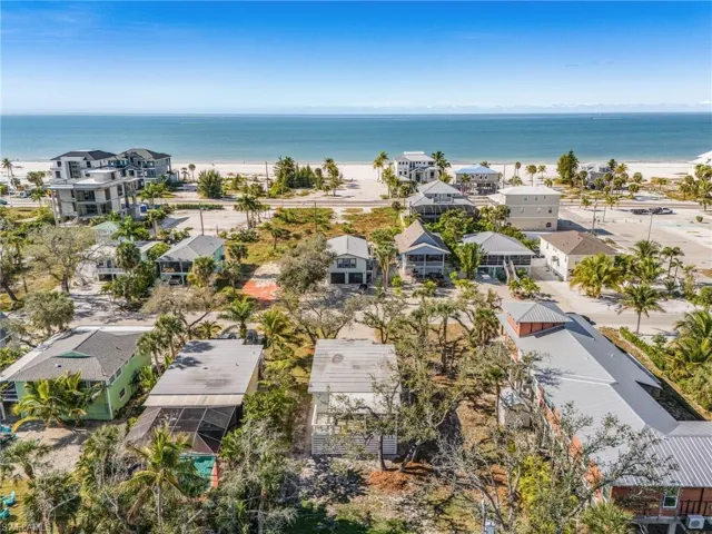 Aerial perspective of suburban area with expansive coastline
