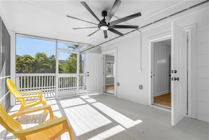 Sunroom featuring ceiling fan