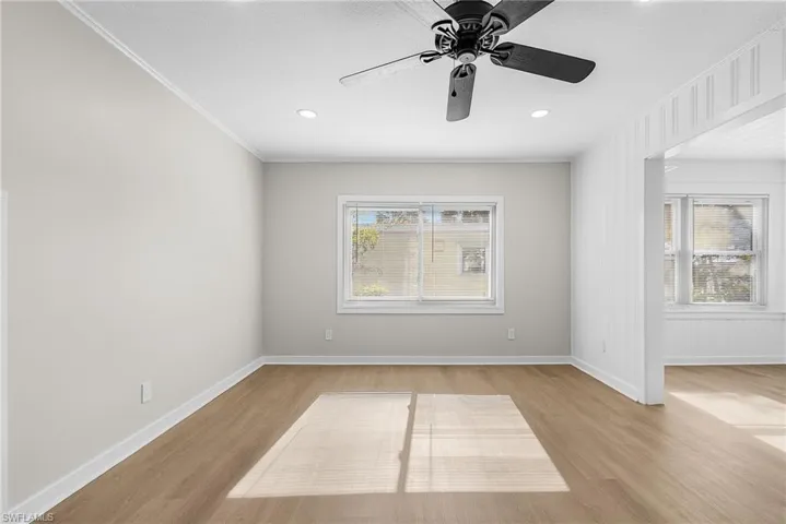 Unfurnished room with light wood finished floors, ceiling fan, and recessed lighting