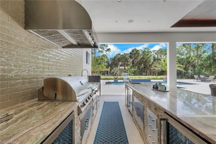 View of patio / terrace with area for grilling and wine cooler
