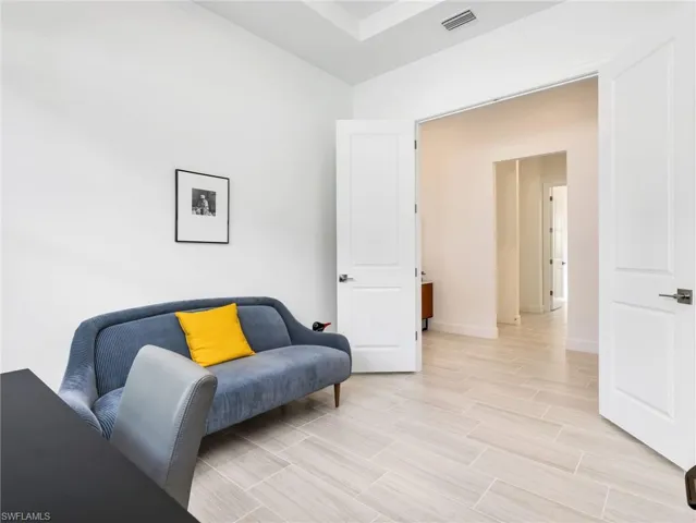 3rd Bedroom with closet, Recessed lighting, light-toned wood-look tile flooring, and solid core doors