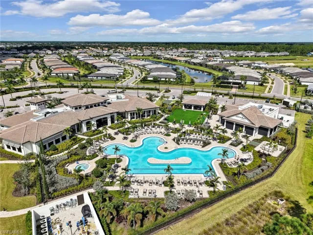 Expansive community pool with integrated spa and surrounding lounge areas