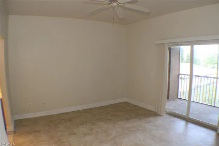 Empty room with baseboards and ceiling fan