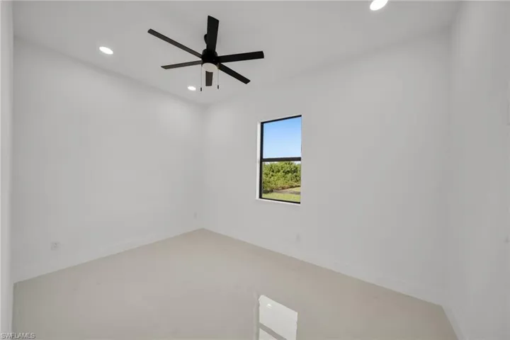 Unfurnished room with recessed lighting and a ceiling fan