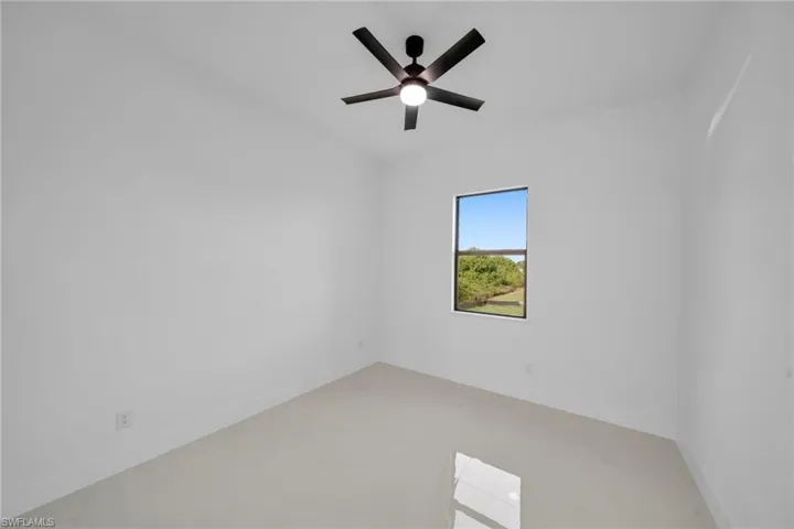 Spare room with ceiling fan