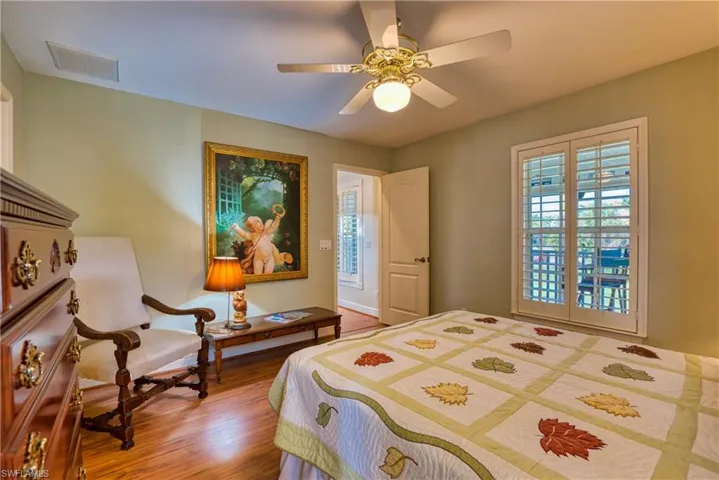 Bedroom featuring wood finished floors and a ceiling fan