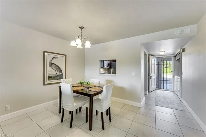 Dining room has a pass through to the kitchen. From the kitchen you have lake views while doing dishes.