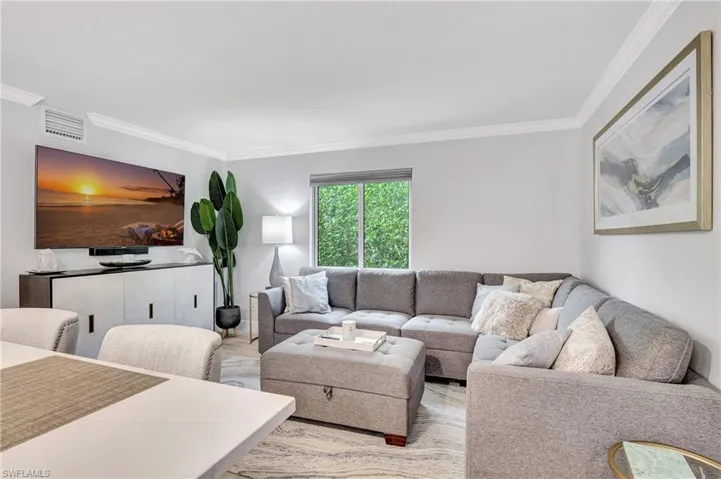 Living room featuring ornamental molding