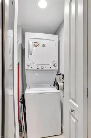Laundry area featuring stacked washer / dryer