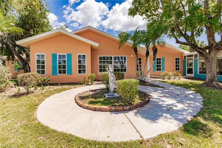 Ranch-style home featuring a front yard