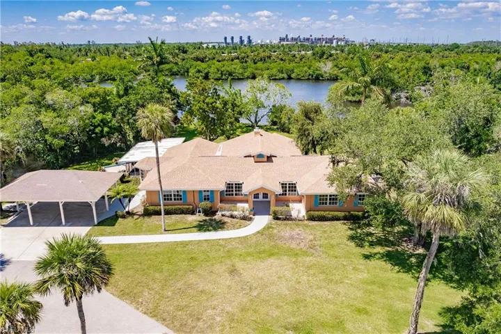 Drone / aerial view featuring a water view with the front of the house