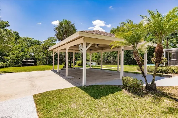 3 carport and spacious parking  featuring a nice lawn