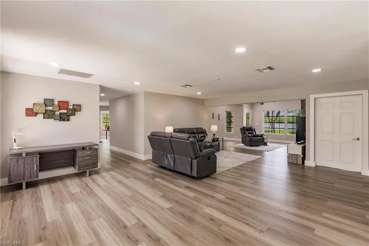 Living room featuring LVT / wood-style flooring