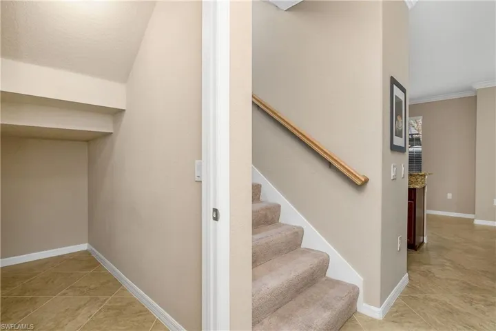 Storage closet under stairway