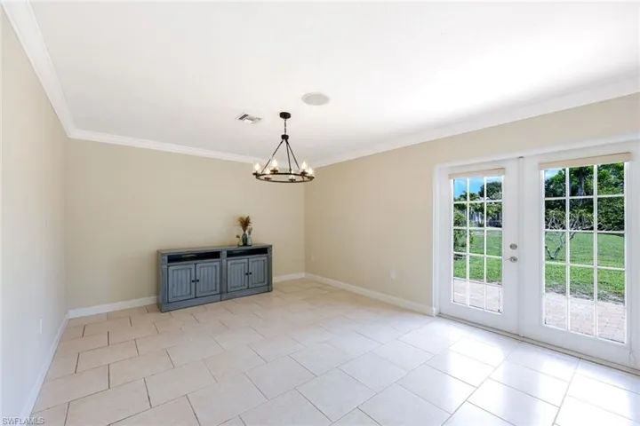 French doors open to paver BBQ pad
