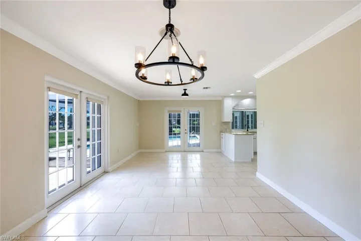 Expansive dining area or den facing pool
