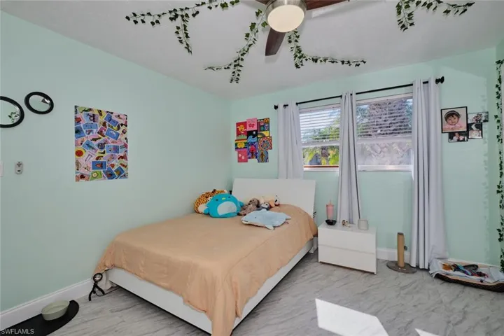 Bedroom featuring ceiling fan