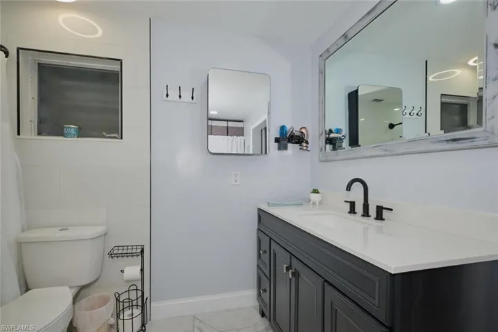 Bathroom with vanity and toilet