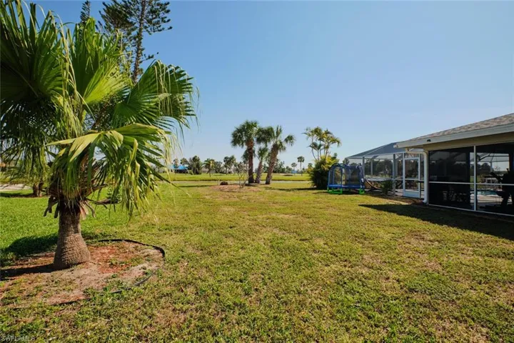 View of yard with a sunroom