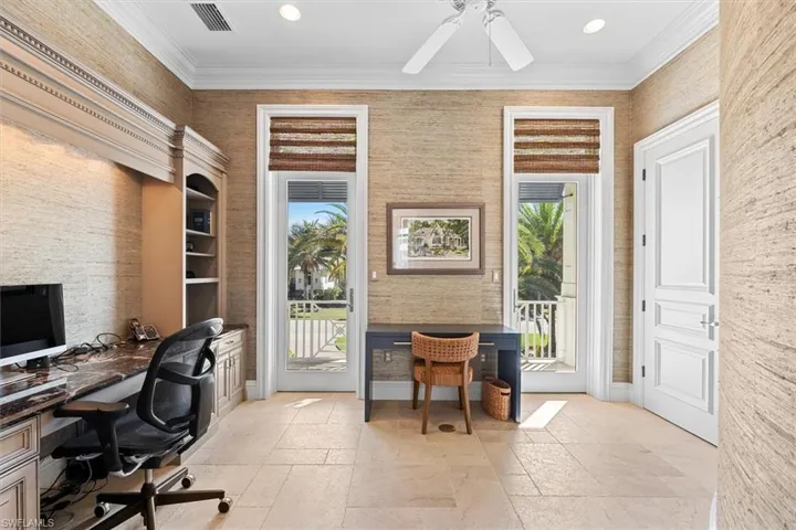 Office with built ins, curved wall and balcony