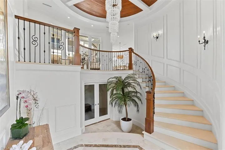 Magnificent entry foyer with curved staircase