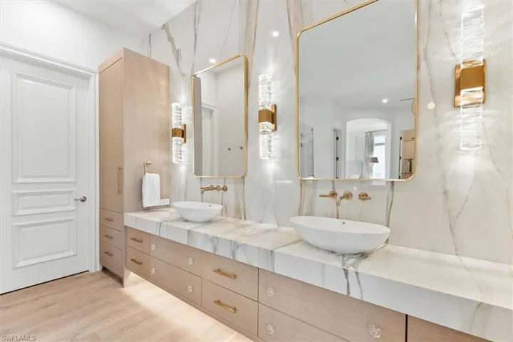 Bathroom with vanity and hardwood / wood-style flooring