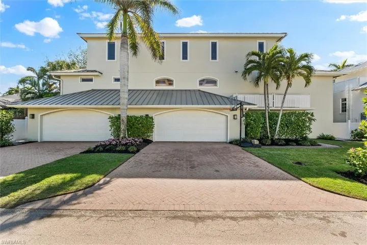 View of front facade featuring a garage