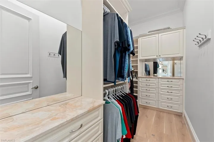Walk in closet featuring light wood-type flooring