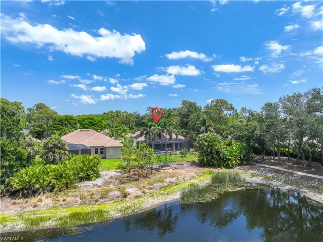Rear aerial of home, lake view
