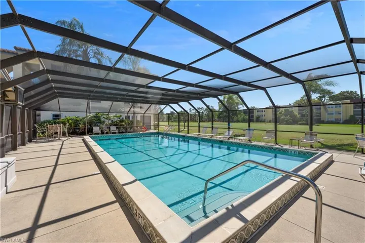 Community pool with screened enclosure