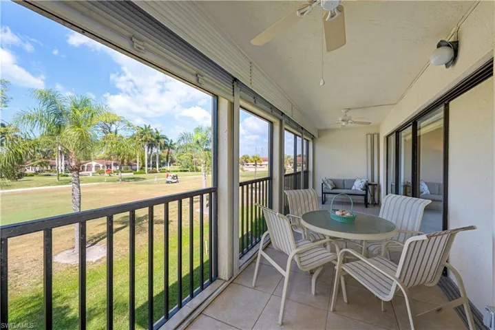 Huge screened lanai with tile floors and storm shutters and outdoor dining area